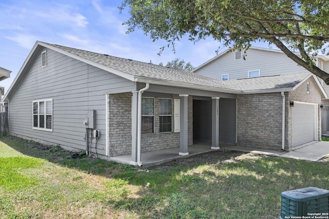 view of front facade with a garage, covered porch, and a front yard