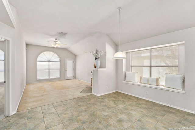 interior space featuring ceiling fan and lofted ceiling