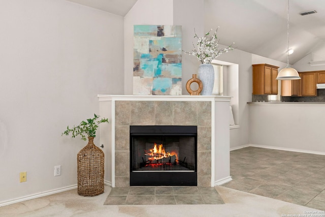 interior details with a tile fireplace