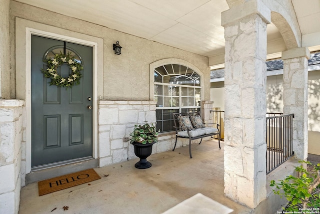 view of exterior entry featuring a porch