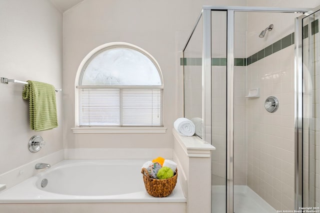 bathroom with separate shower and tub