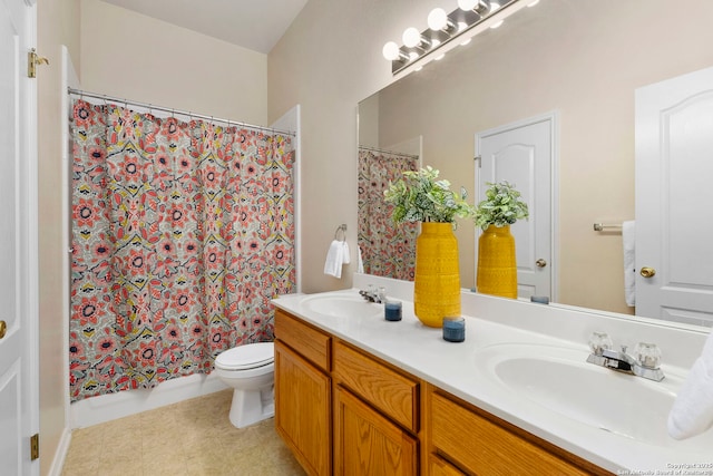 bathroom with vanity, toilet, and a shower with shower curtain