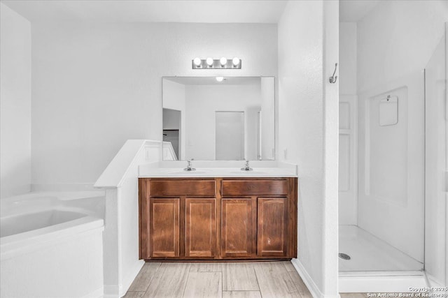 bathroom with plus walk in shower and vanity