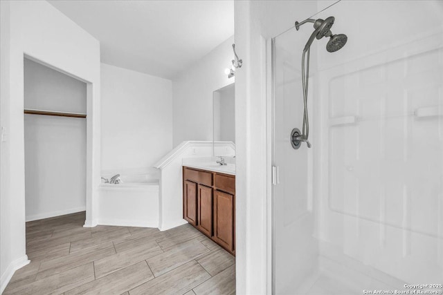 bathroom with vanity and a shower