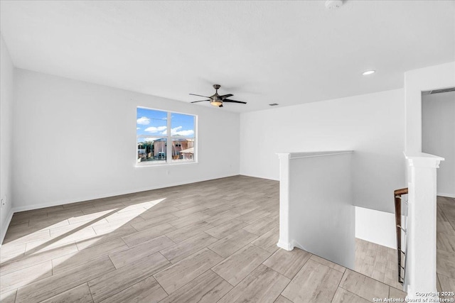 empty room featuring ceiling fan