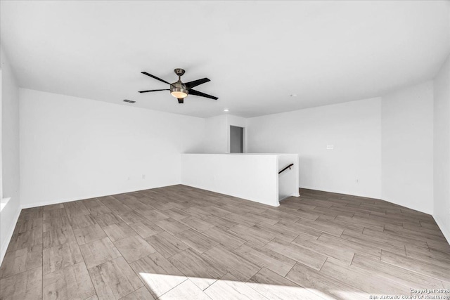 interior space featuring ceiling fan