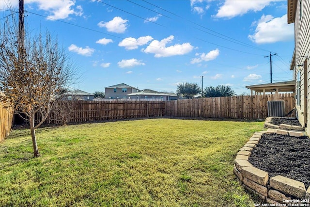 view of yard featuring central AC unit