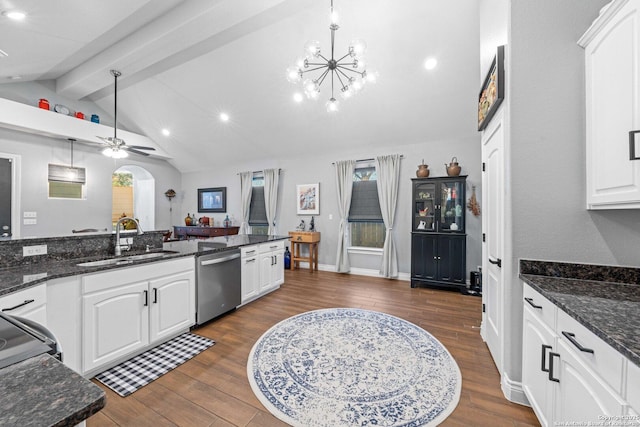 kitchen with dishwasher, hanging light fixtures, sink, white cabinets, and dark stone countertops