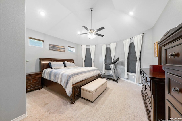 carpeted bedroom featuring ceiling fan and vaulted ceiling