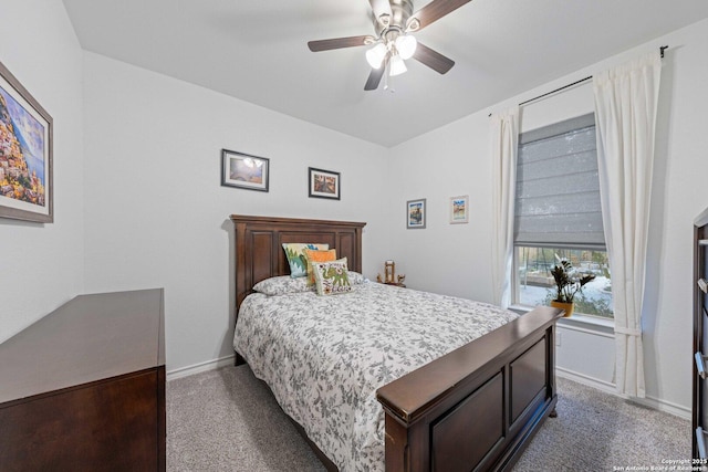 bedroom featuring dark carpet and ceiling fan