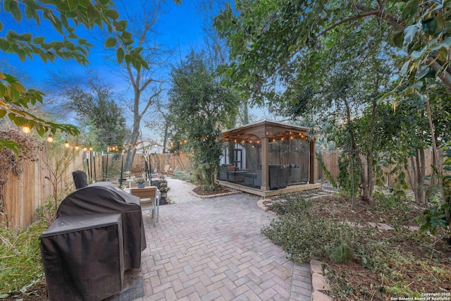 view of patio / terrace featuring a gazebo and a grill