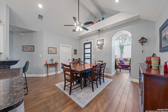 dining room with ceiling fan, beamed ceiling, and high vaulted ceiling