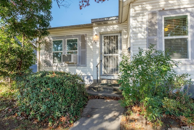 doorway to property featuring cooling unit