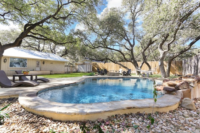 view of swimming pool with a patio area