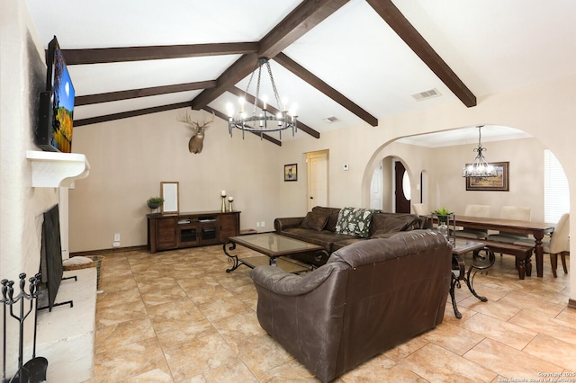 living room featuring lofted ceiling with beams and a chandelier