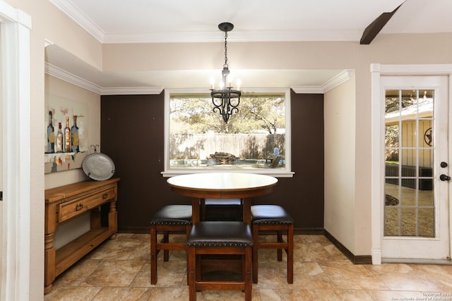 dining space with crown molding, plenty of natural light, and an inviting chandelier