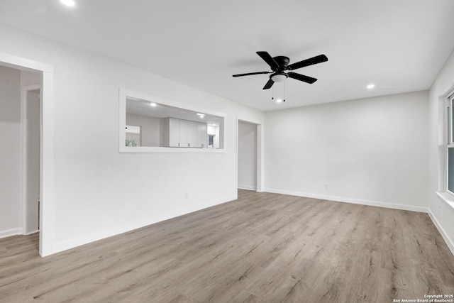 unfurnished living room featuring light hardwood / wood-style floors and ceiling fan