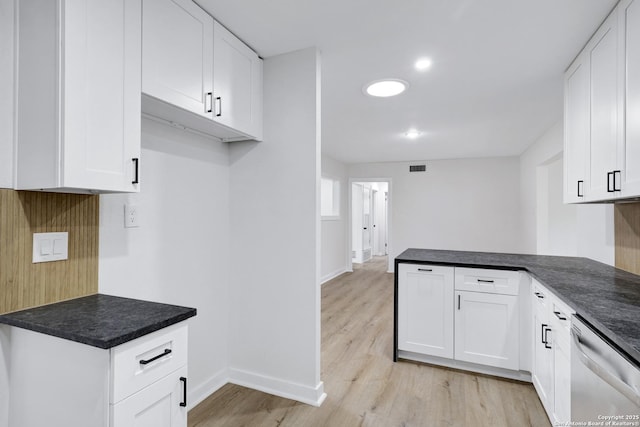 kitchen with white cabinetry, dishwasher, kitchen peninsula, and light hardwood / wood-style flooring