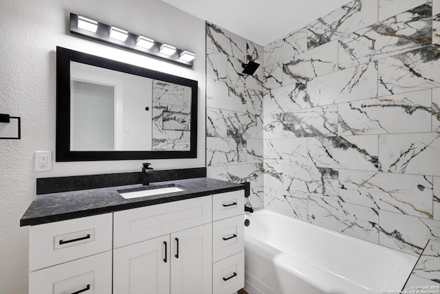 bathroom with shower / tub combination and vanity