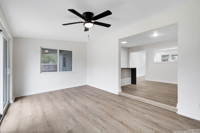 spare room featuring ceiling fan and light hardwood / wood-style floors