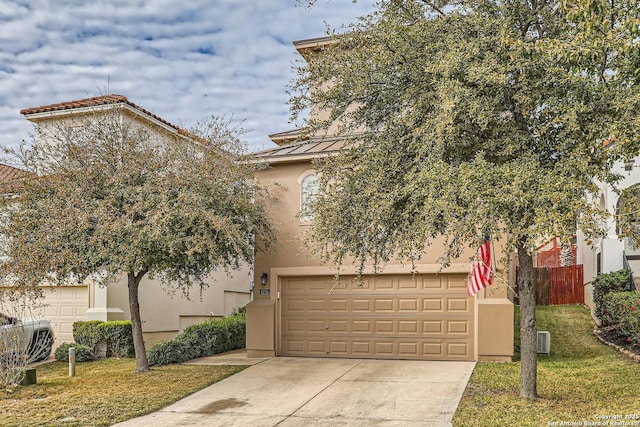 view of front facade with a garage and a front lawn