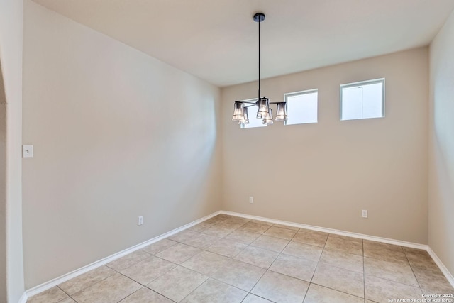 unfurnished dining area featuring light tile patterned flooring and a chandelier