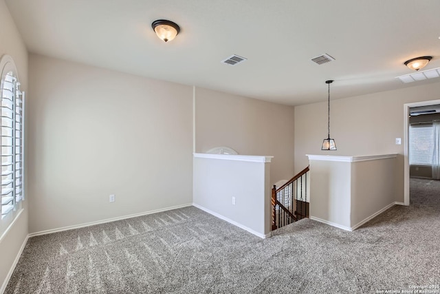 empty room featuring carpet flooring