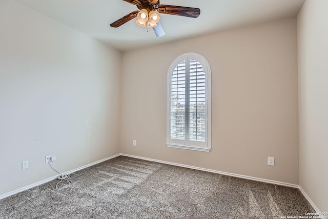 empty room featuring carpet floors and ceiling fan