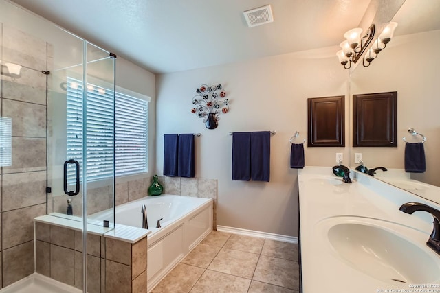 bathroom with tile patterned flooring, vanity, and plus walk in shower