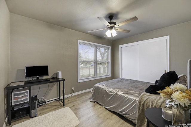 bedroom featuring a closet, ceiling fan, and light hardwood / wood-style floors