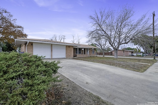 ranch-style house featuring a garage