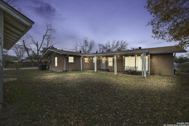 back house at dusk with central AC