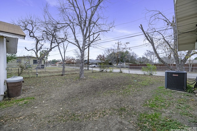 view of yard featuring central air condition unit