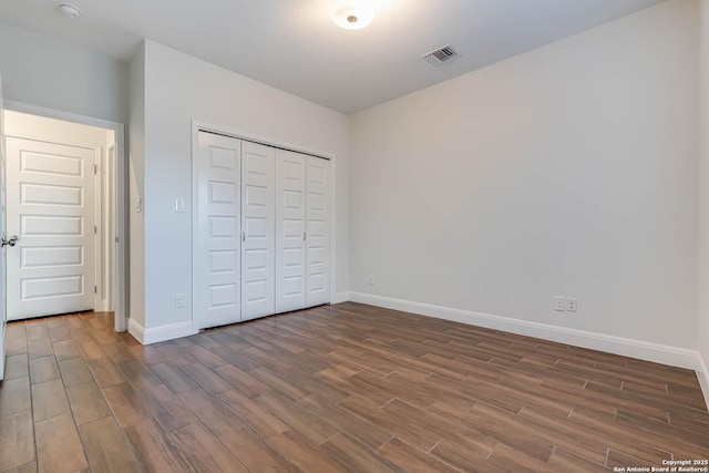 unfurnished bedroom with a closet