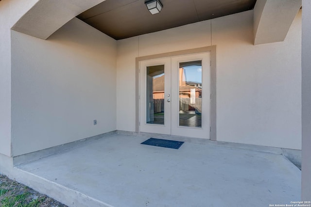 doorway to property featuring a patio area and french doors