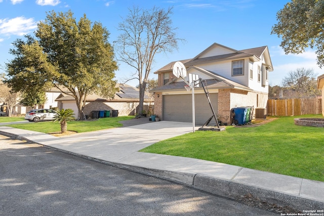 view of front of house with a garage, central AC, and a front yard