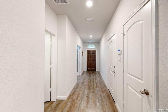 hallway featuring light hardwood / wood-style floors