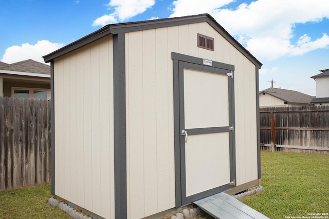 view of outdoor structure with a yard