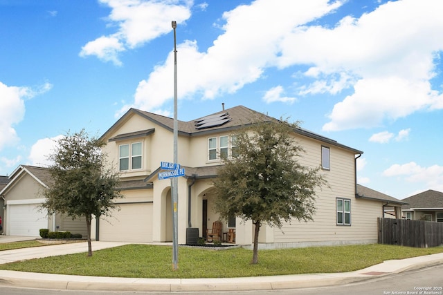 view of front facade with a garage, central air condition unit, a front lawn, and solar panels