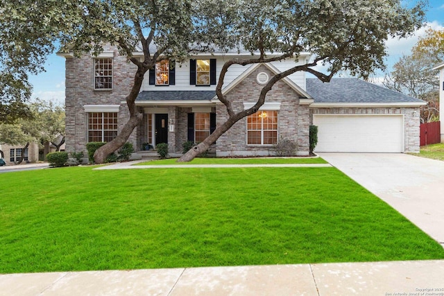 view of front of property with a garage and a front lawn