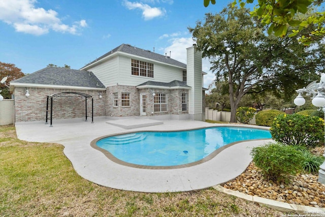 view of swimming pool with a patio area