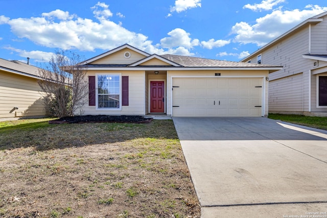 view of front of house with a front yard and a garage