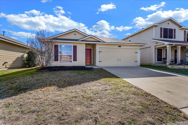 view of front of house featuring a front yard and a garage