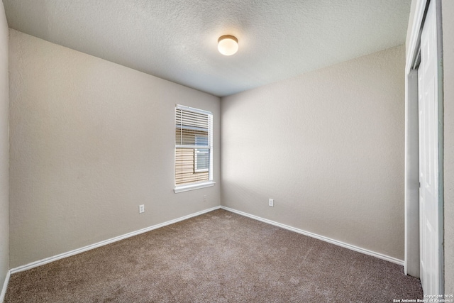 empty room featuring carpet floors