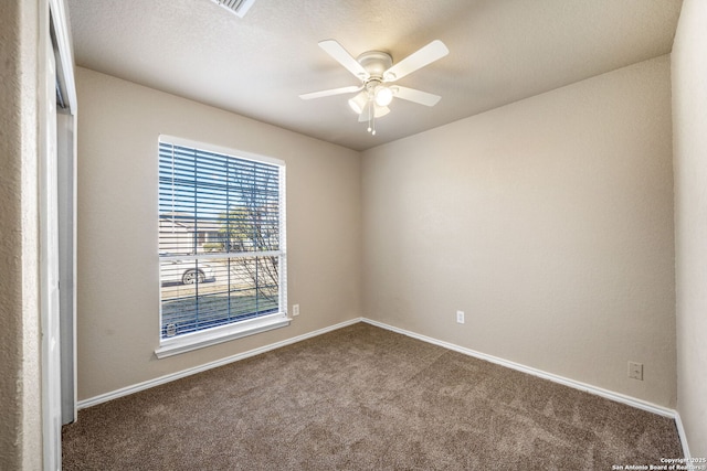 unfurnished room with carpet flooring and ceiling fan