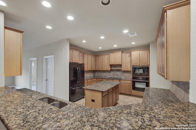 kitchen featuring light brown cabinets, kitchen peninsula, a kitchen island, decorative backsplash, and black appliances