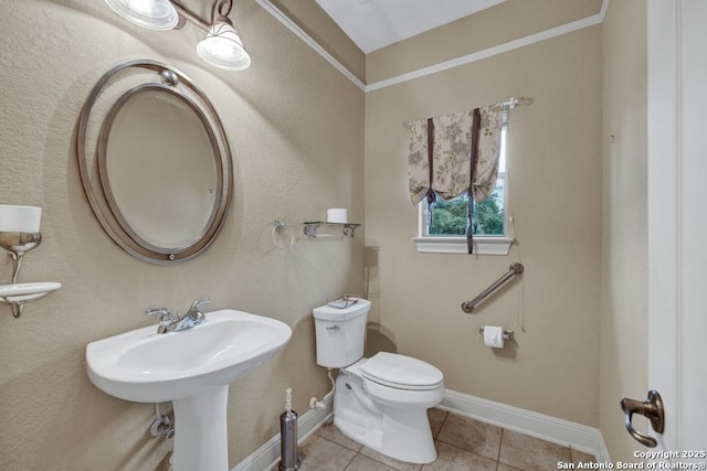 bathroom with tile patterned flooring and toilet