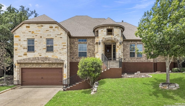 french country home with a garage and a front yard