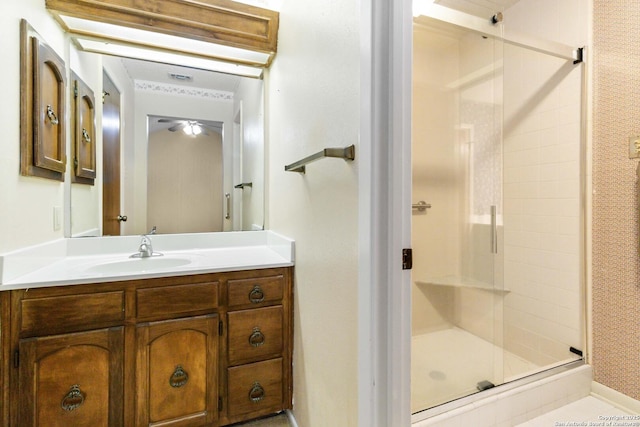 bathroom with vanity and an enclosed shower