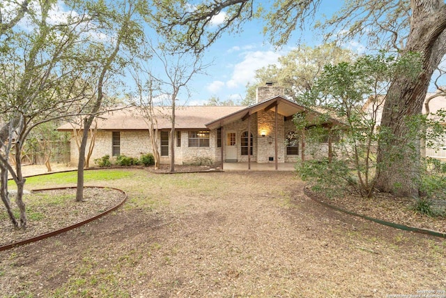 exterior space with a patio and a lawn